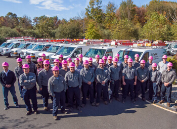 View showcasing the Tucker Service team along with service trucks